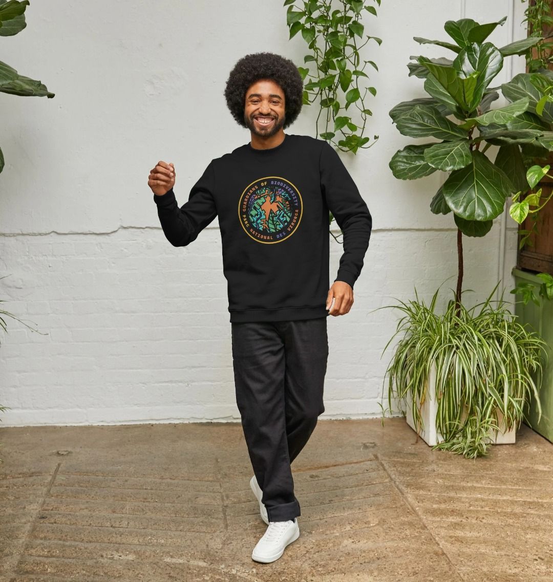 A man wearing a black Guardians of Biodiversity Men's Sweater