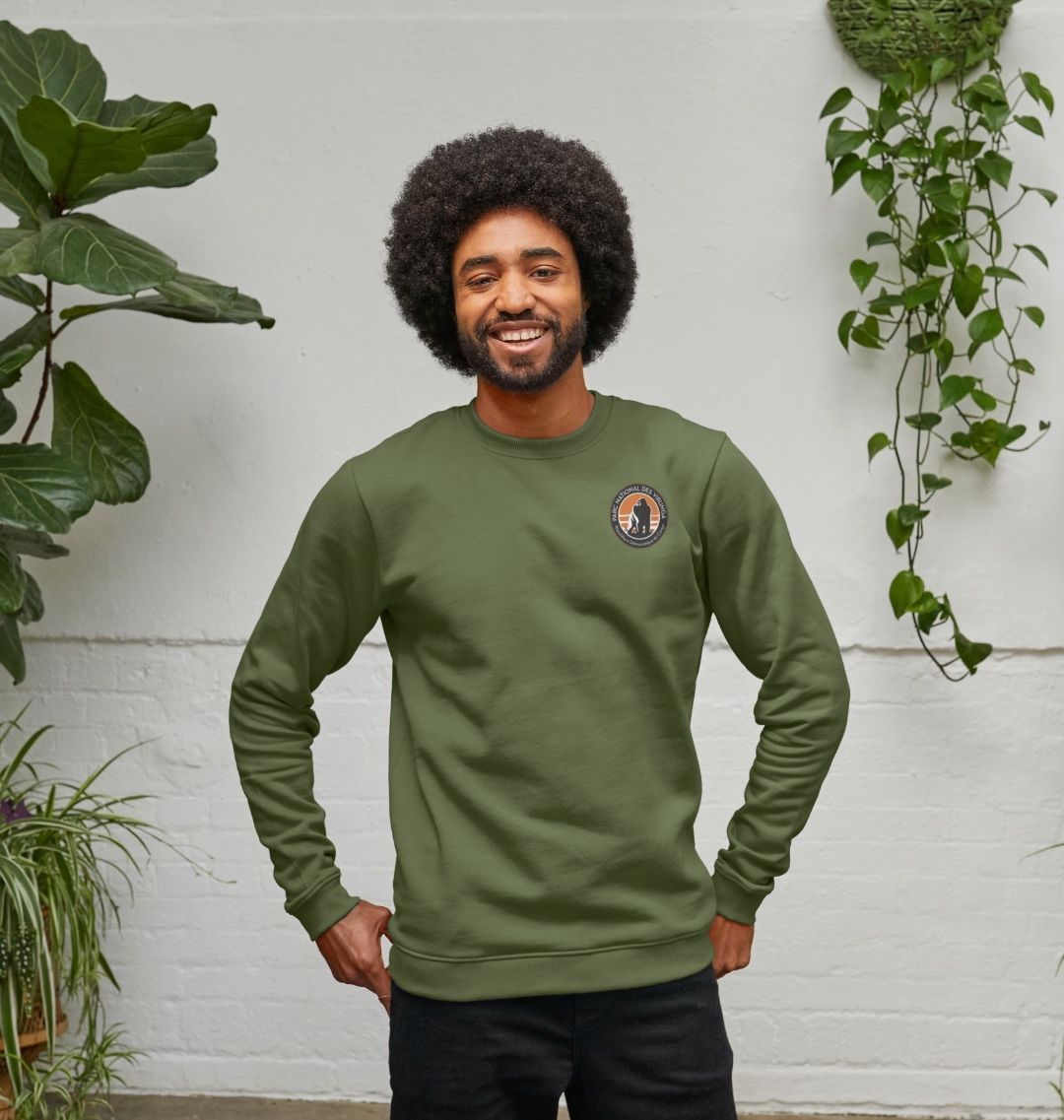 A man wearing an evergreen Virunga Pocket Logo Men's Sweater