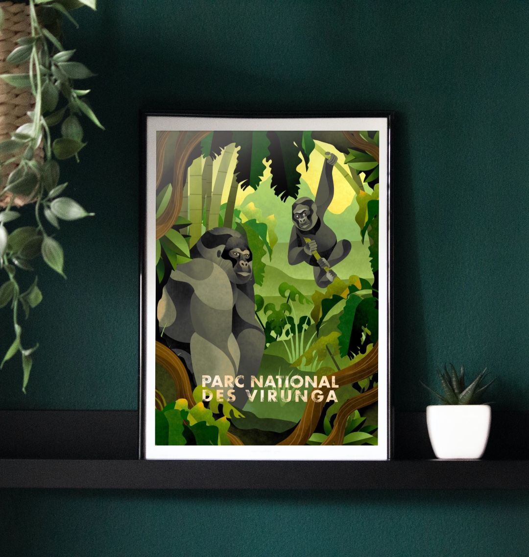 A framed poster depicting mountain gorillas in a lush forest setting