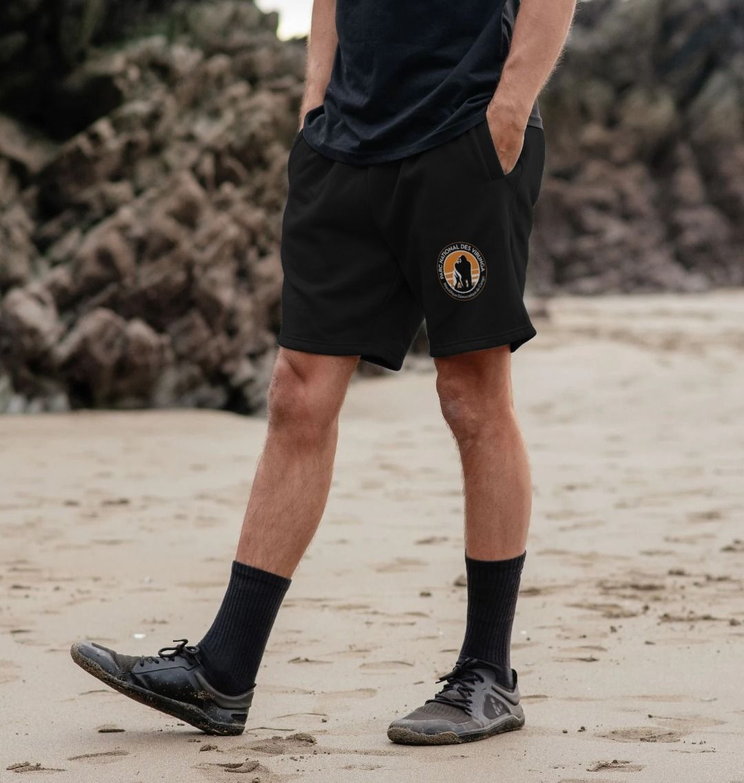 Person wearing black Virunga Logo Men's on a beach