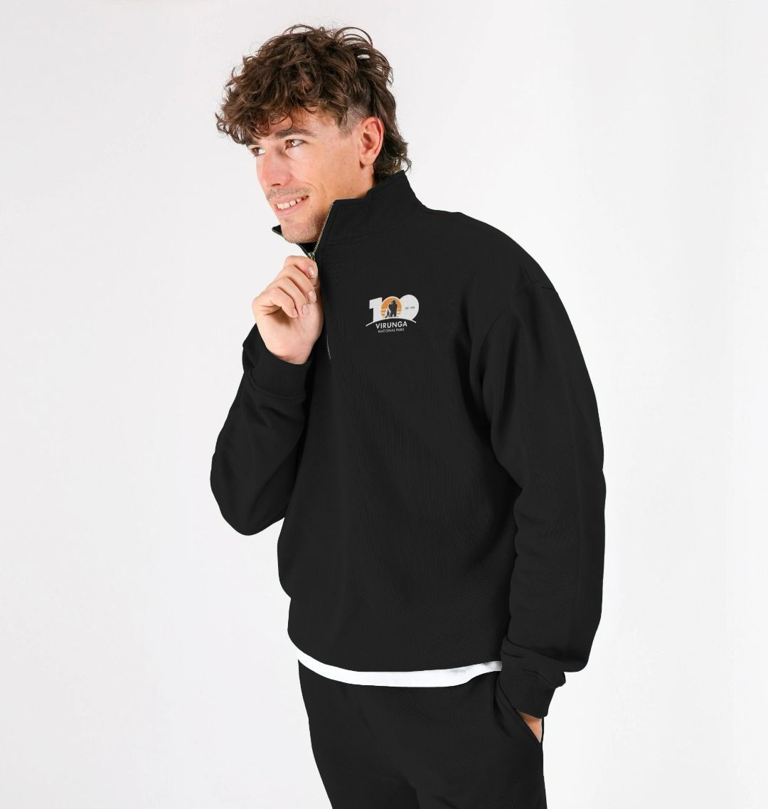 A person wearing a black Virunga 100 Unisex Zip Pullover