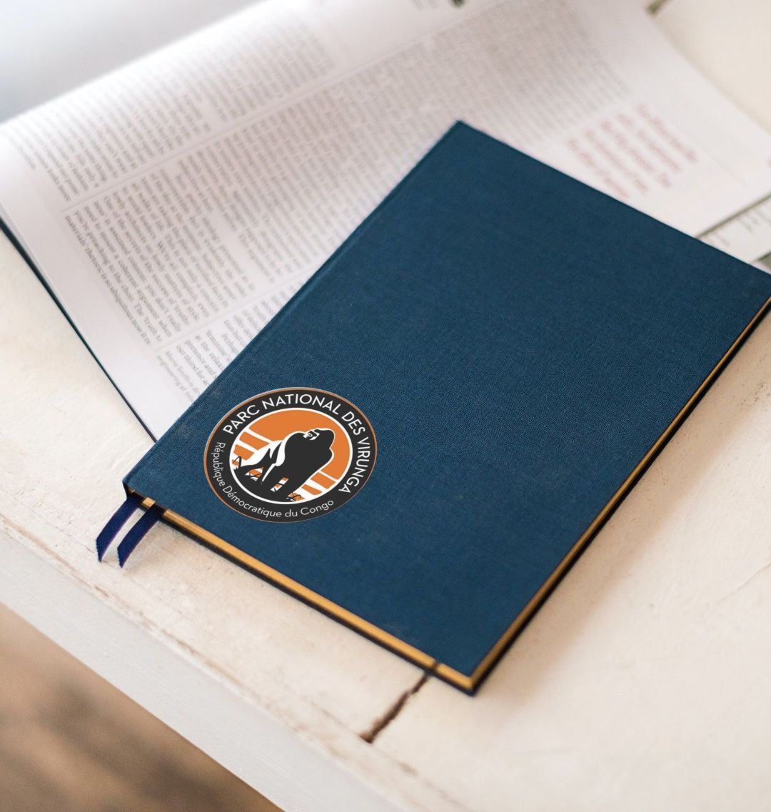 Virunga Logo Sticker on a Blue Notebook