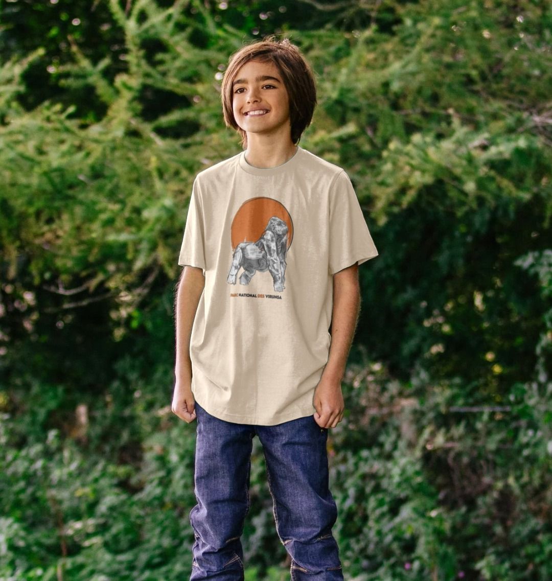 A Kid wearing an oat Ndakasi Kids T-shirt in the forest