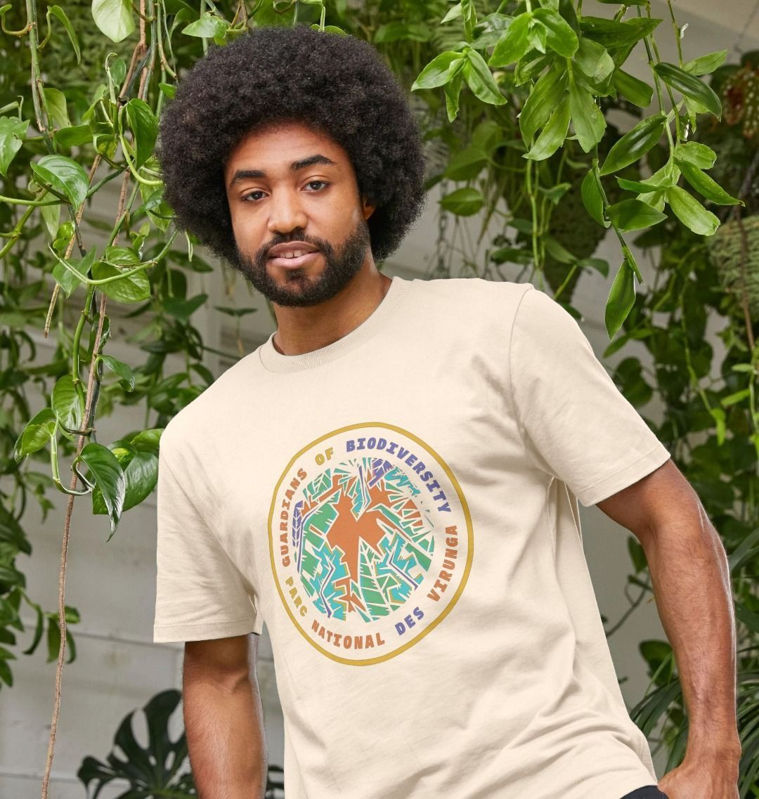 A Man wearing an oat Guardians of Biodiversity men's t-shirt