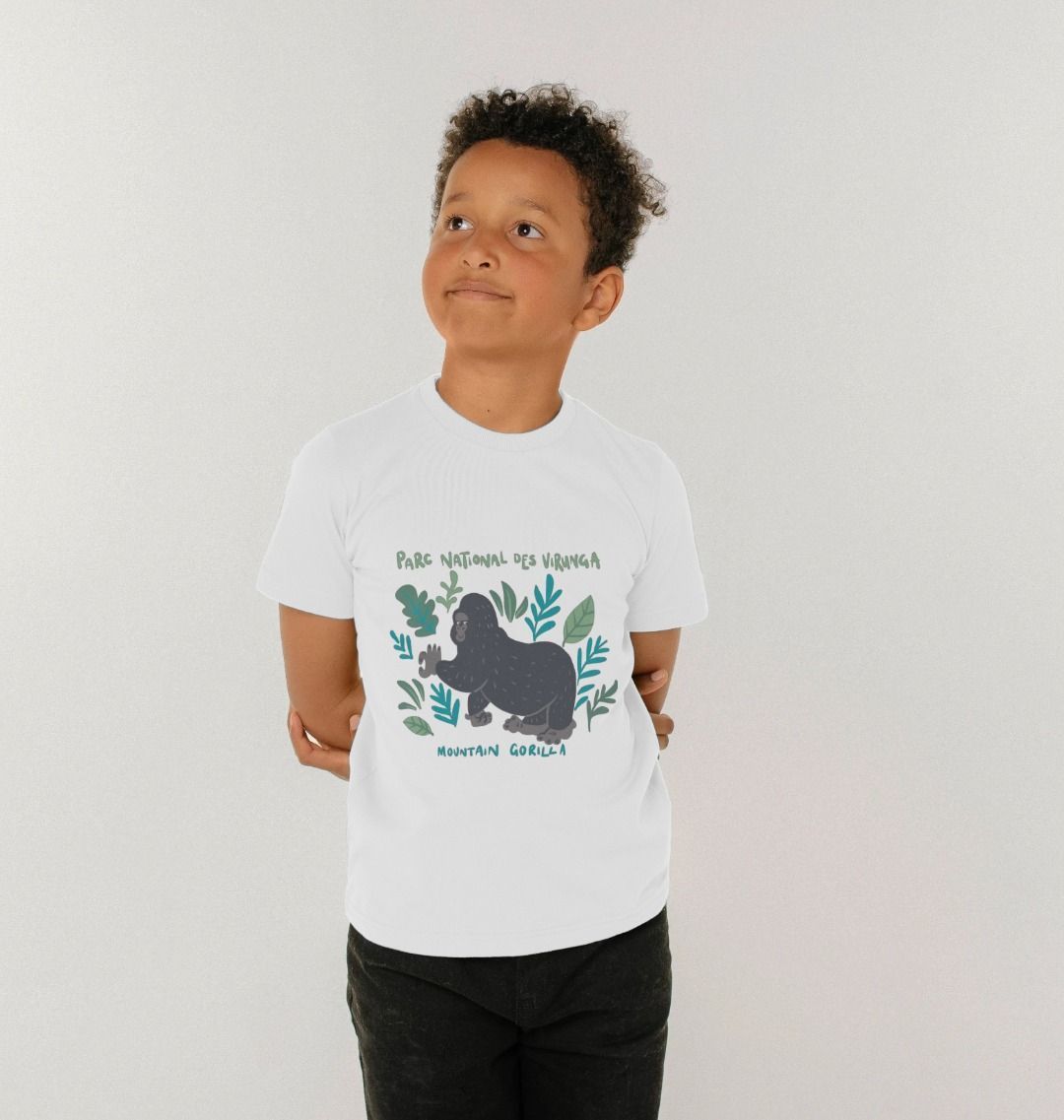 A child wearing a white kid's gorilla t-shirt, standing against a plain background.