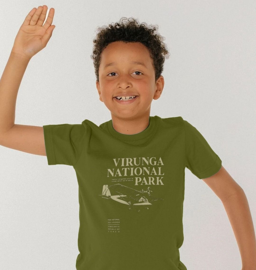 A kid wearing a moss Virunga Pilot Kids T-shirt