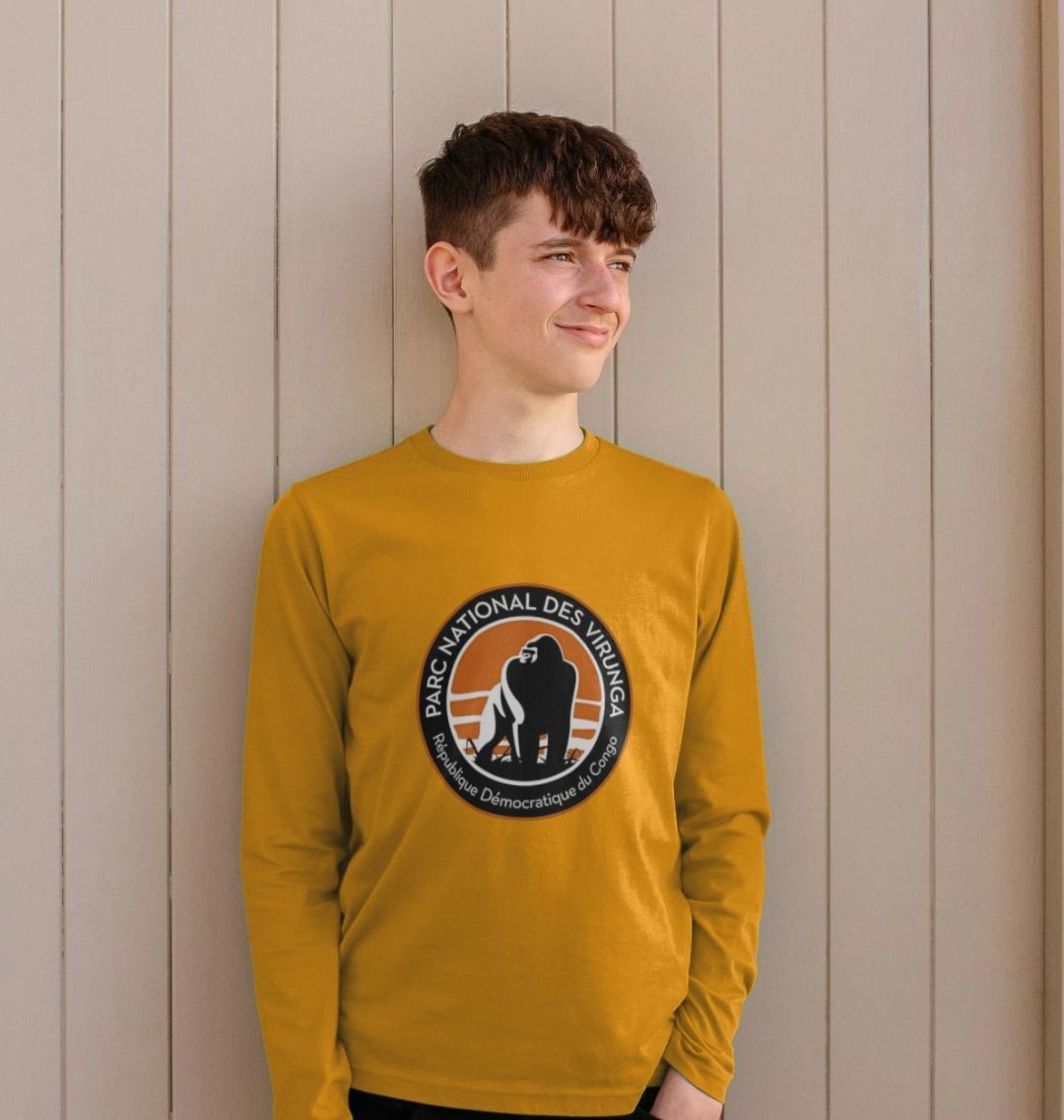 A kid wearing a mustard Virunga Logo Kids Long Sleeve