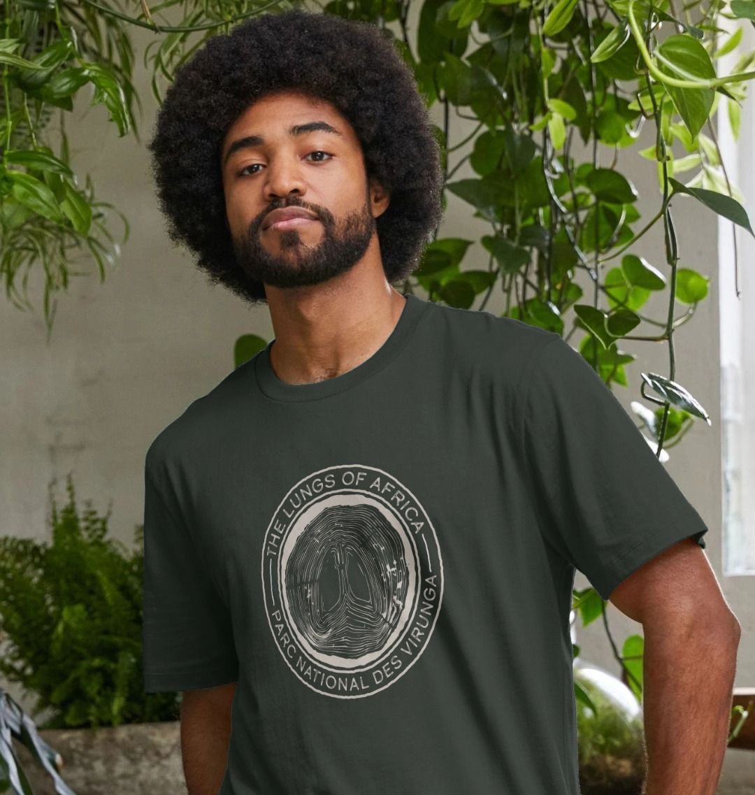 A man wearing a dark grey Lungs of Africa Men's T-shirt