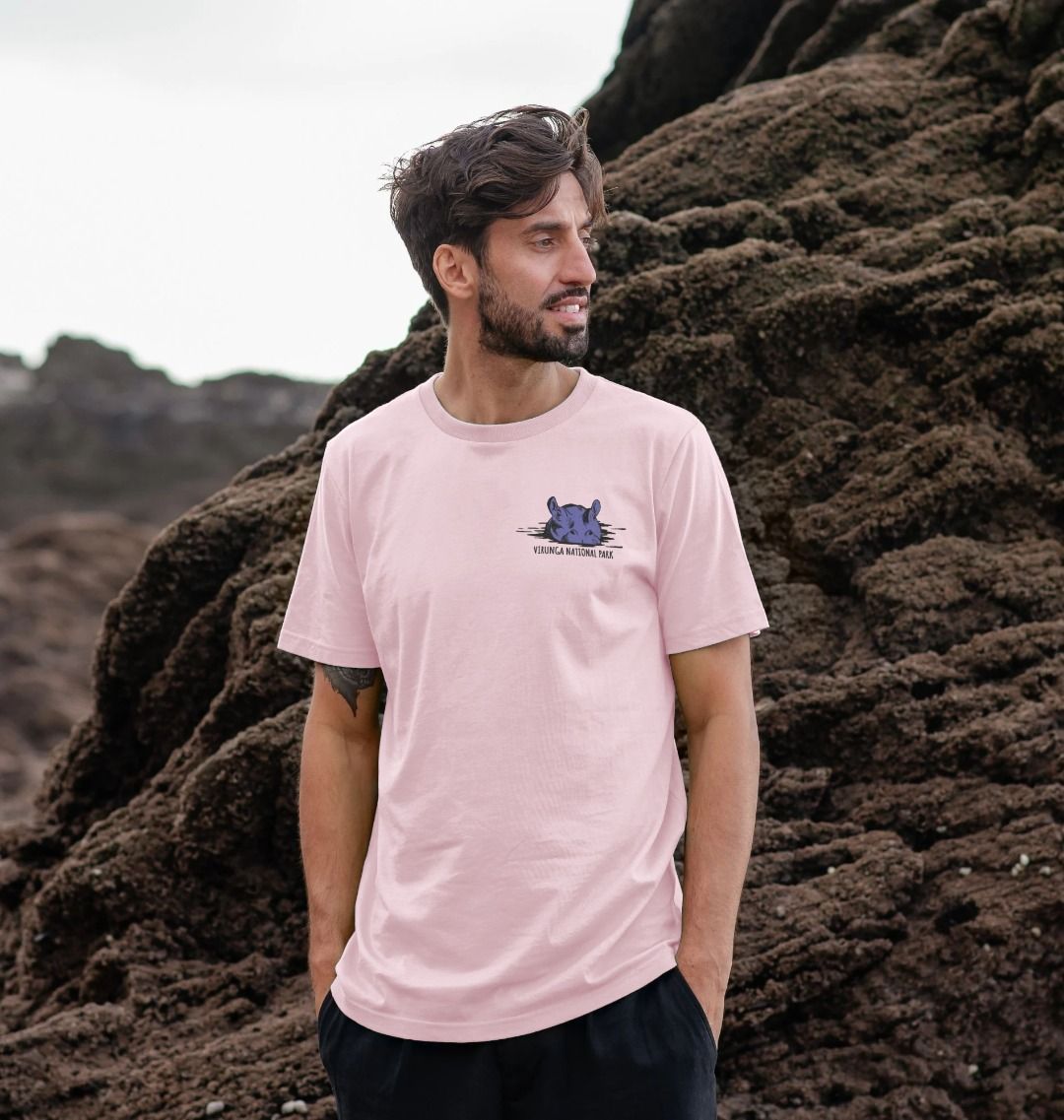 A man wearing a pink Virunga Hippo T-shirt