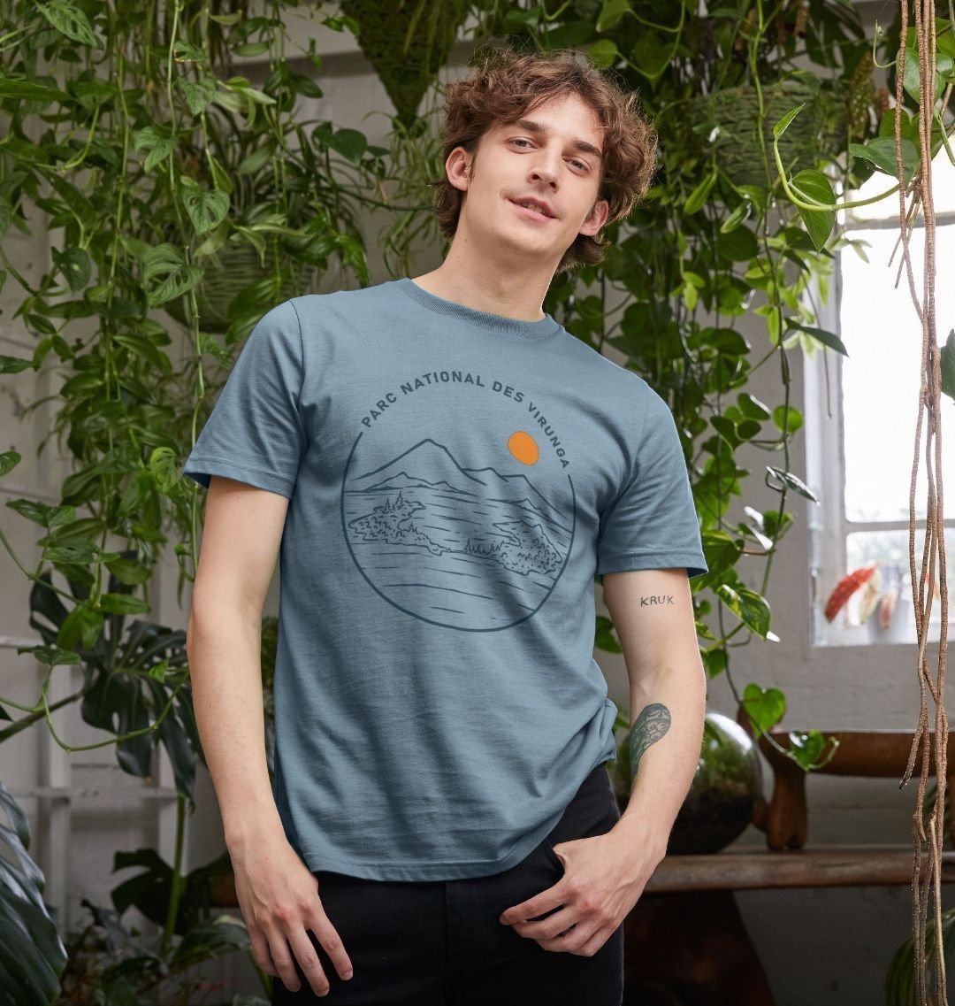 A man wearing a stone blue Tchegera Island T-shirt for men