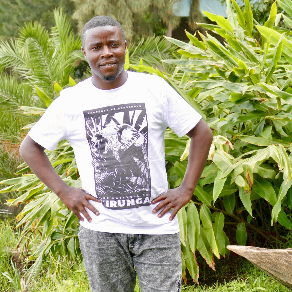A man wearing a white African Elephant Black Print Men's T-shirt