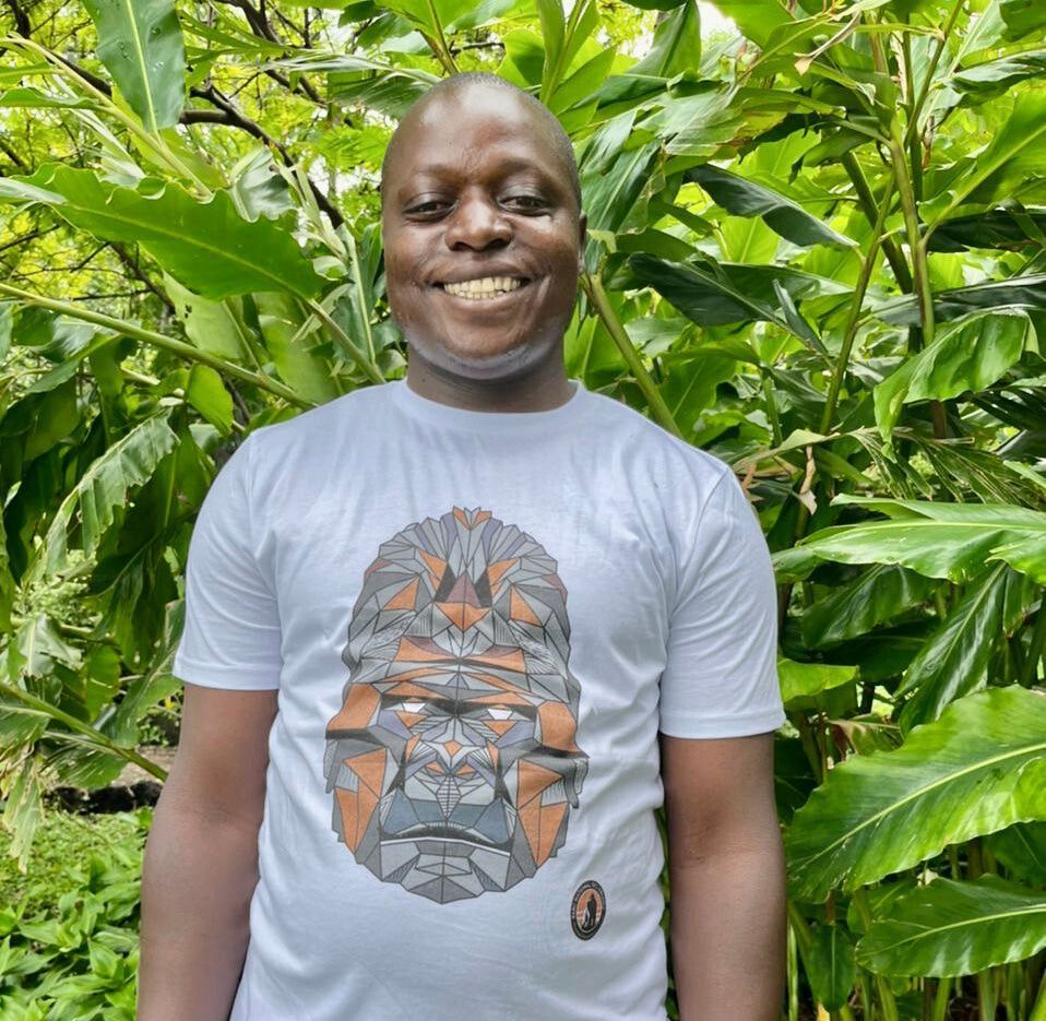 A man wearing a white Men's Gorilla Face T-shirt