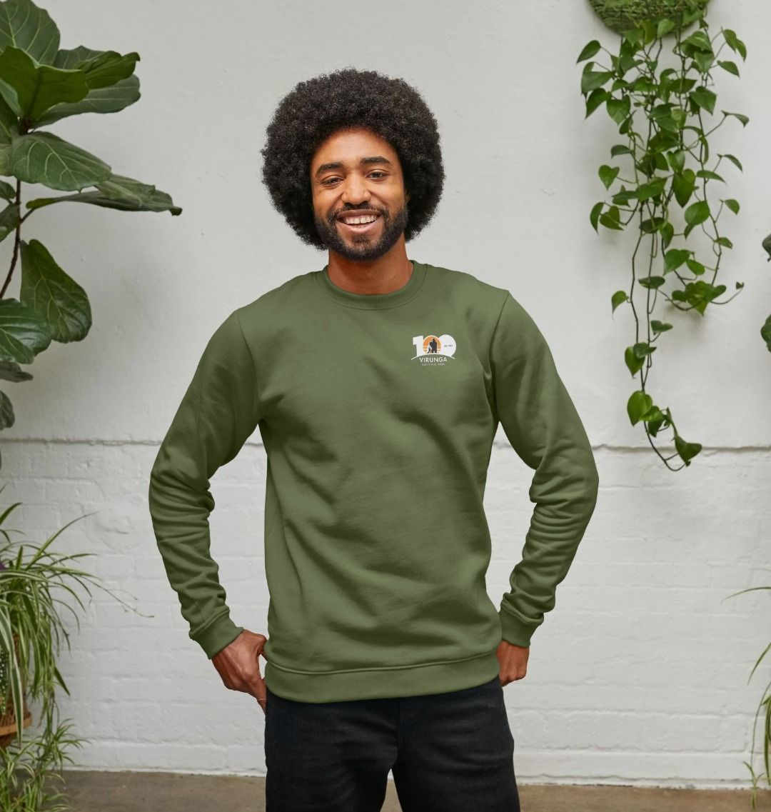 A man wearing aan evergreen Virunga 100 Men's Sweater