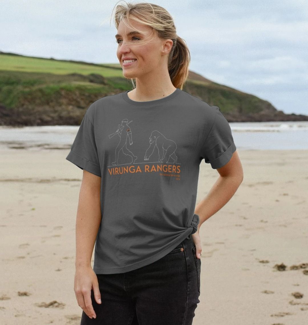 A woman on the beach wearing a slate grey mountain gorilla ranger women's relaxed tee
