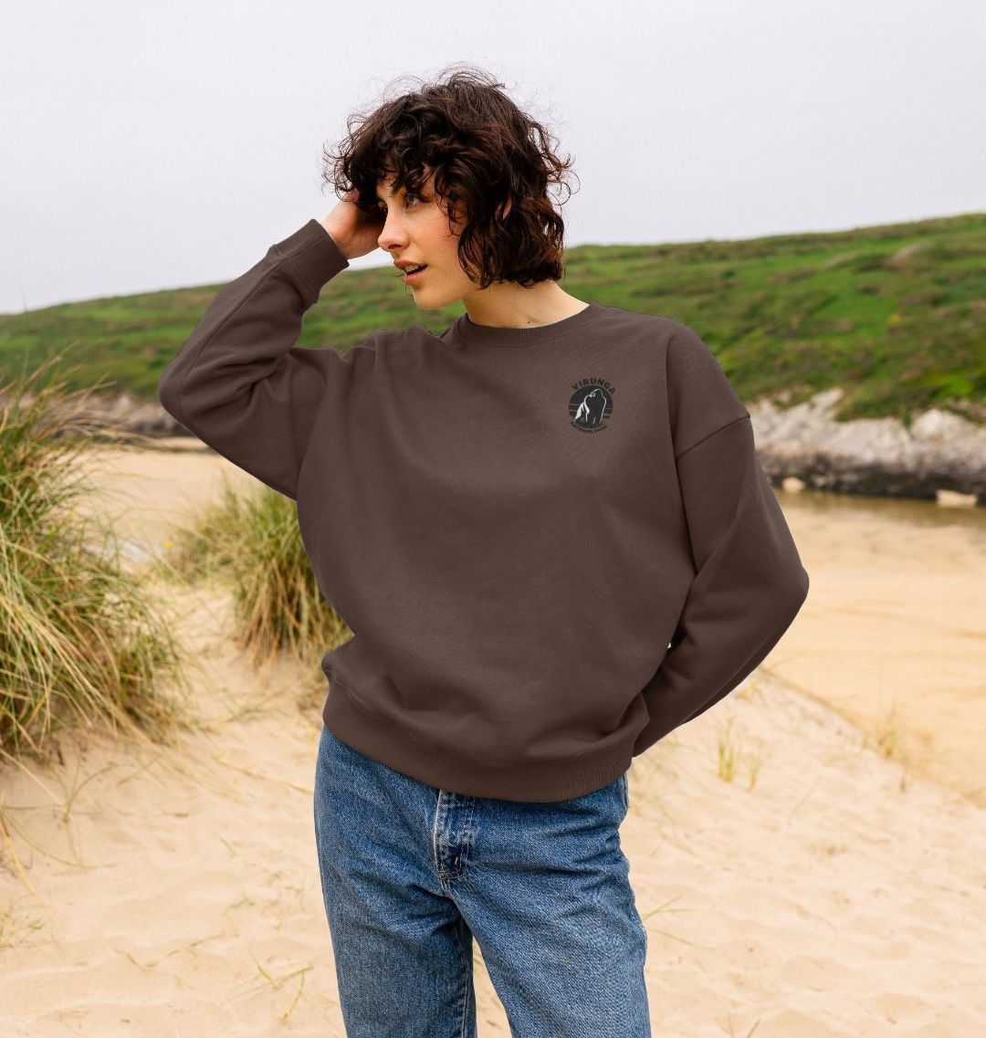 A woman wearing a chocolate Gorilla Pocket Logo Oversized Jumper.