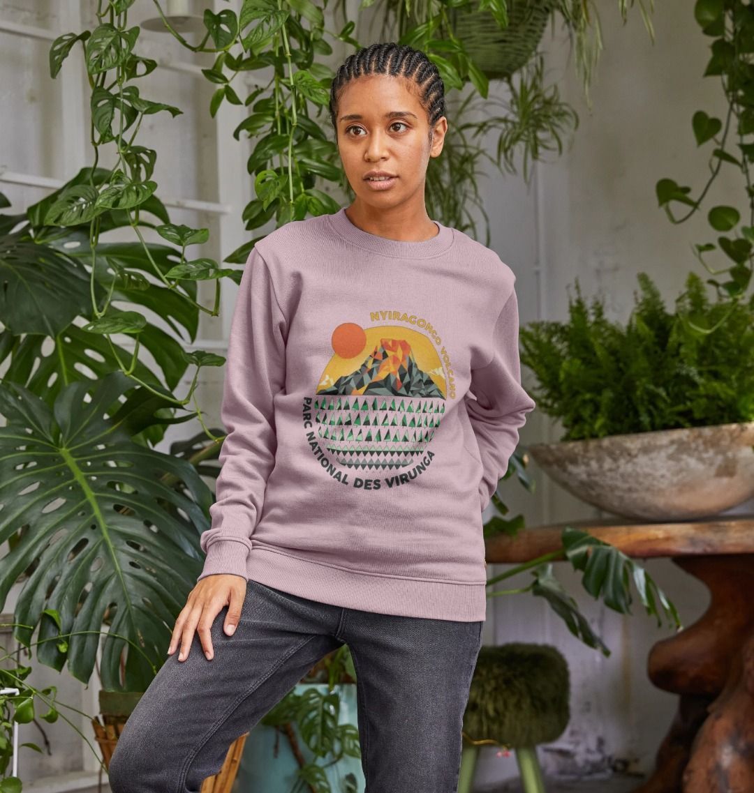 A woman wearing a mauve Nyiragongo Volcano Women's Sweater