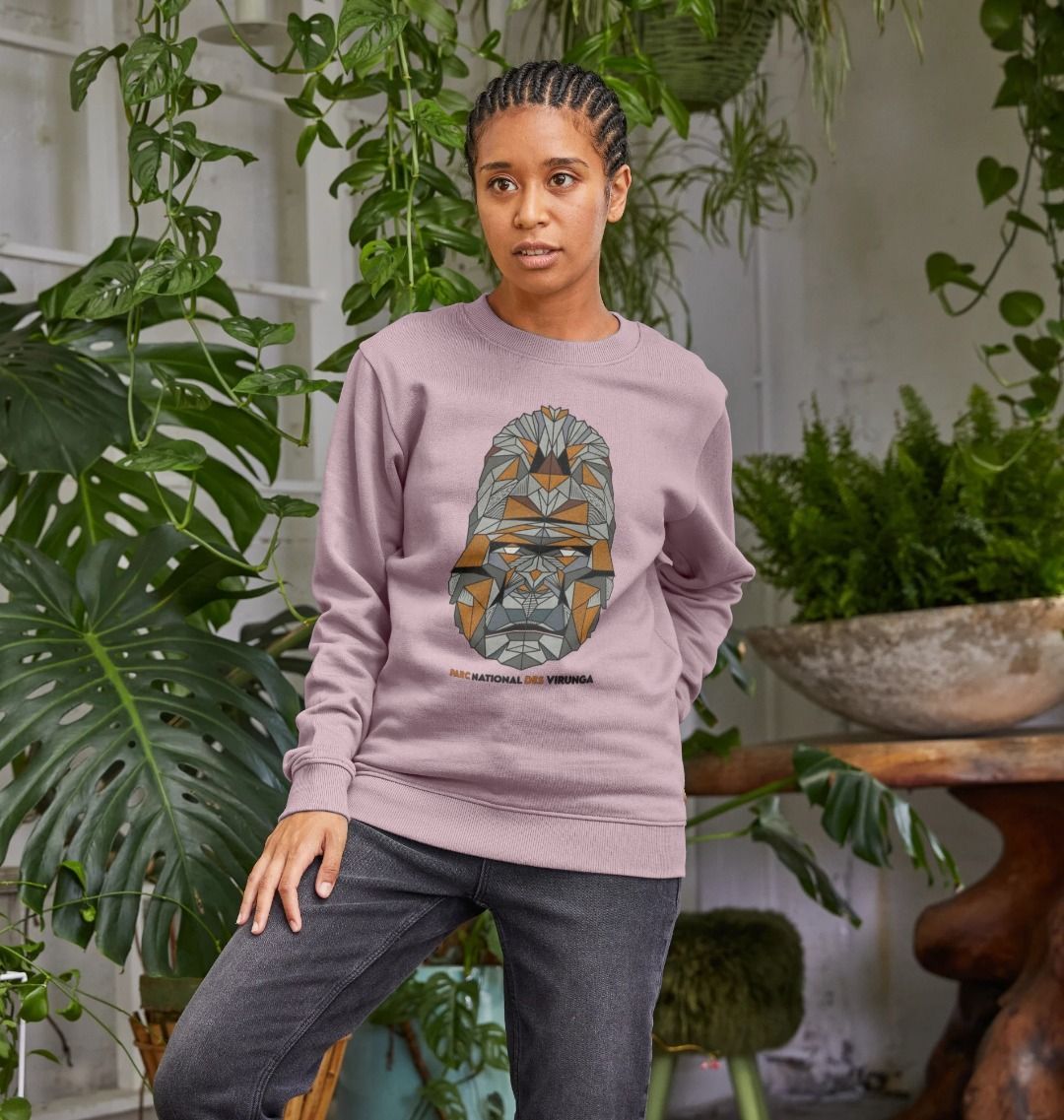 A woman wearing a mauve Women's Gorilla Face Sweater  and a black pant