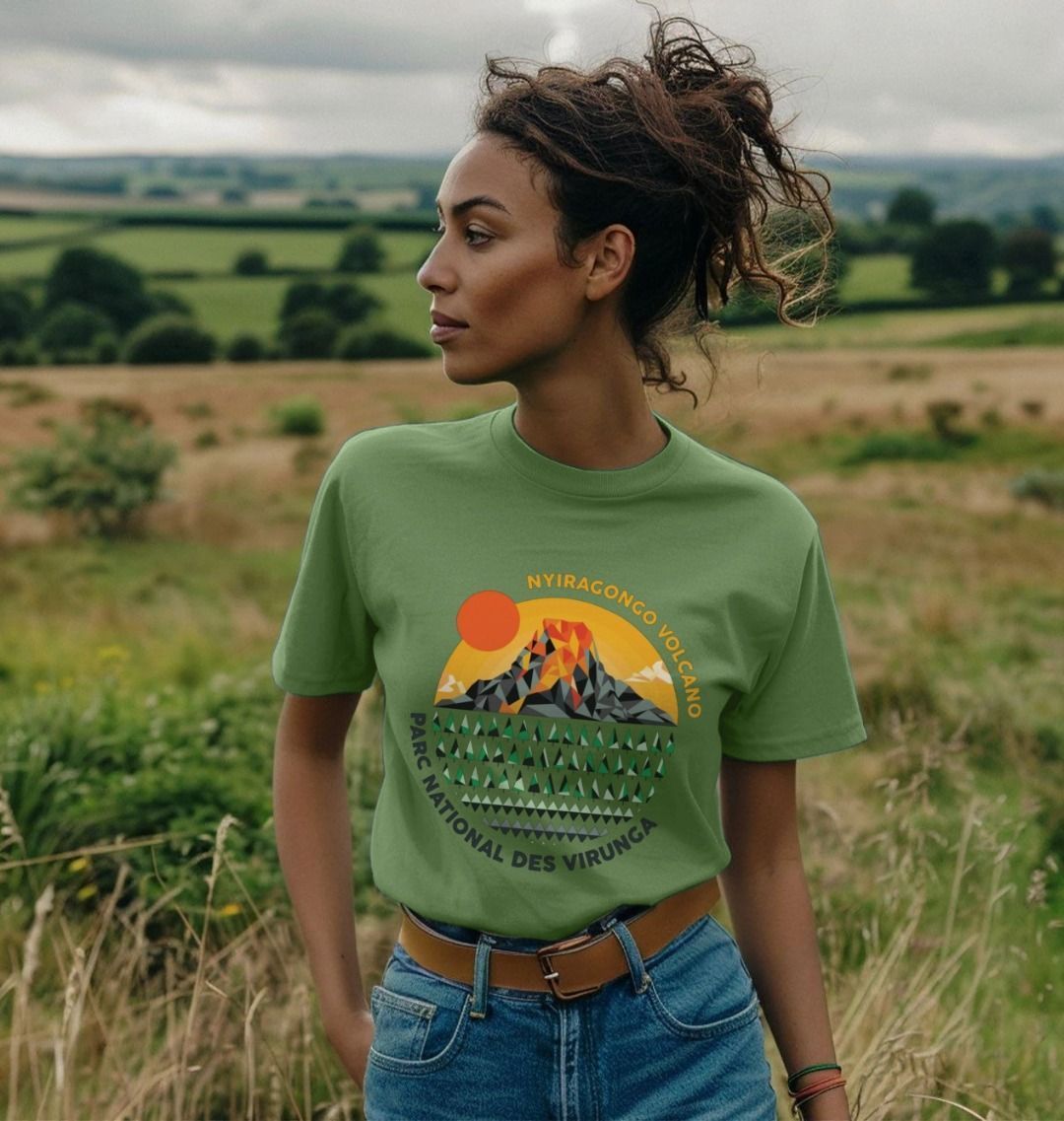 A woman wearing a sage Nyiragongo Volcano Women's T-shirt in the field