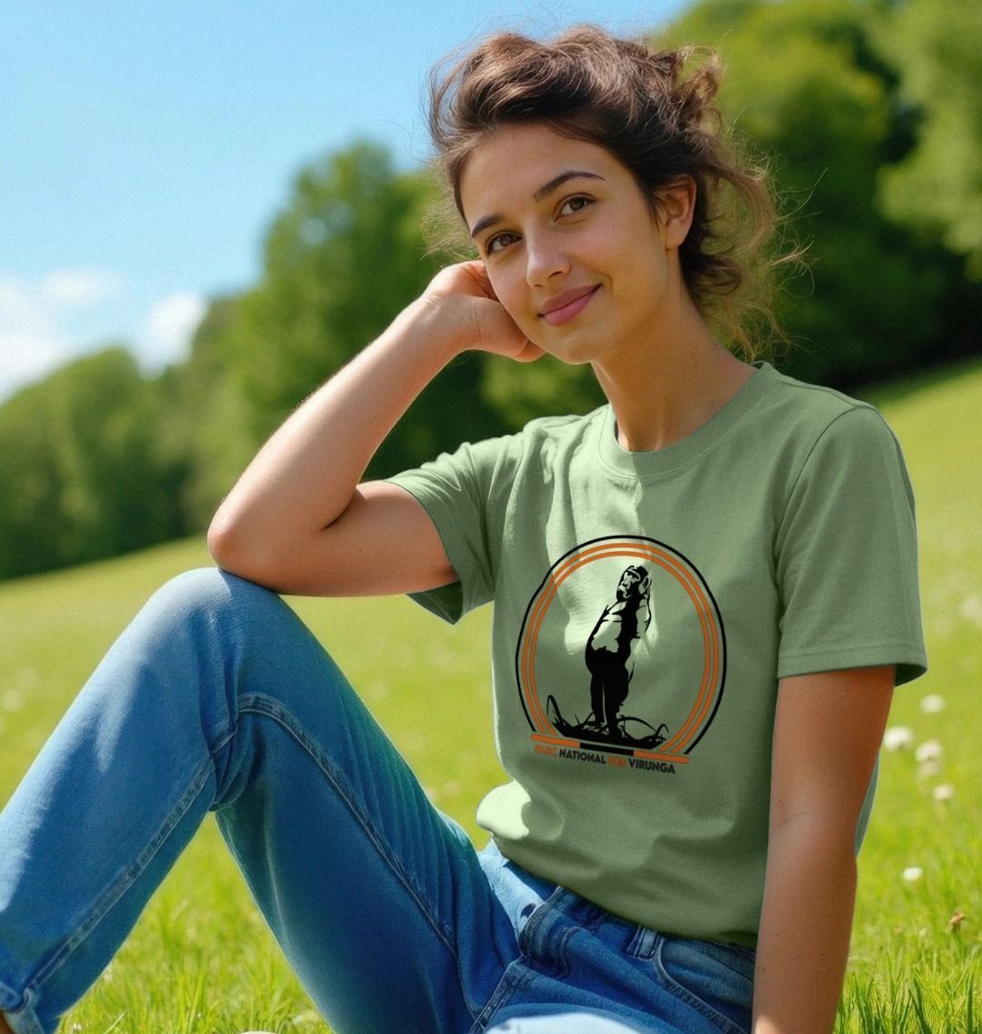 A woman wearing a sage Take A Stand Women's T-shirt.