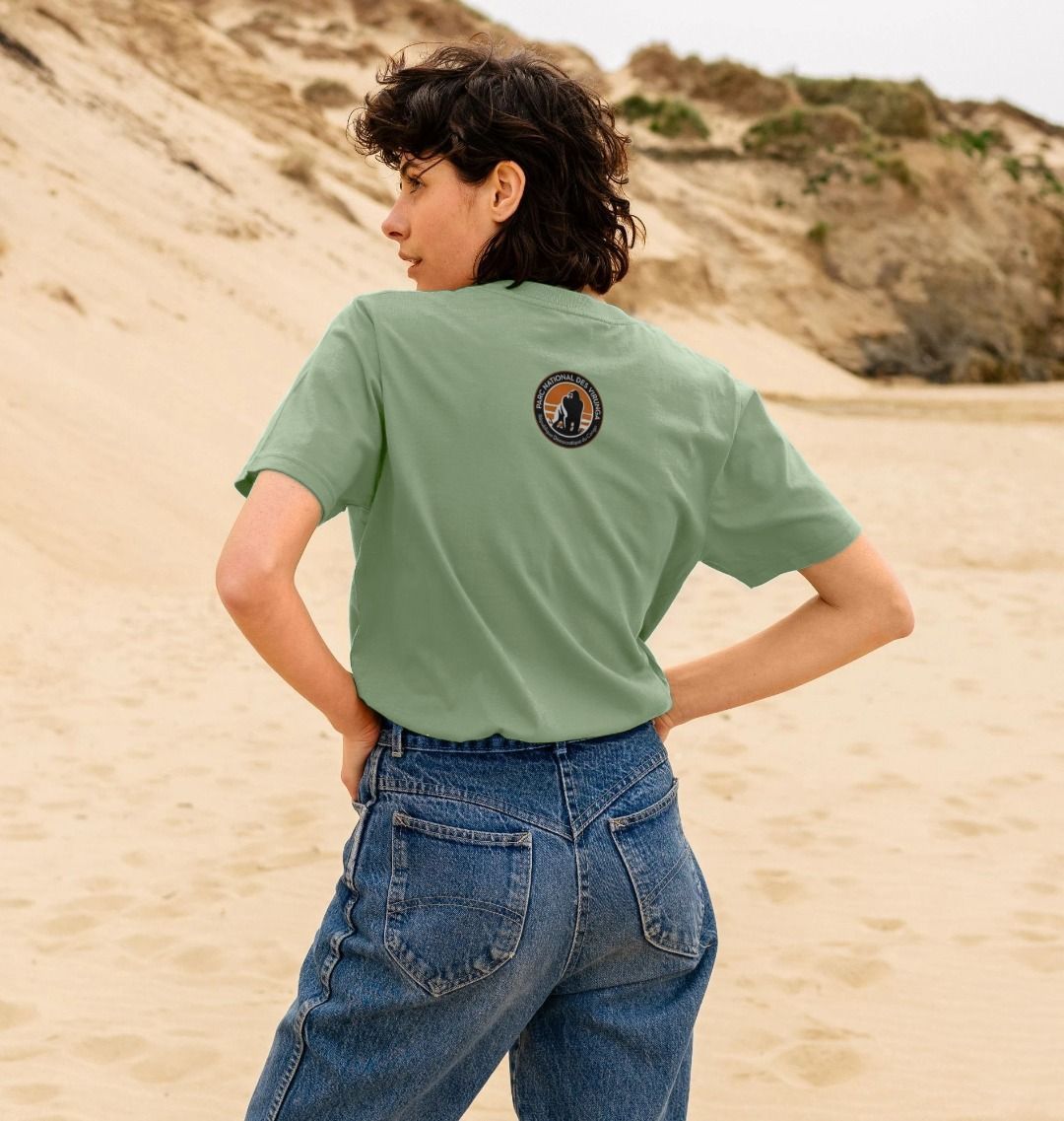 A woman wearing a sage bageni family women's T-shirt