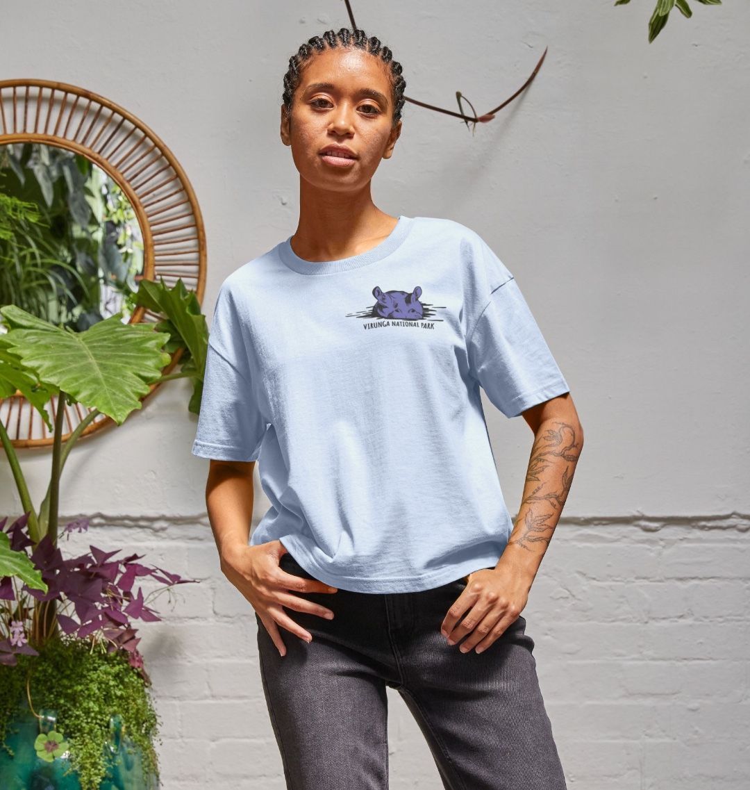 A woman wearing a sky blue hippo women's boxy tee