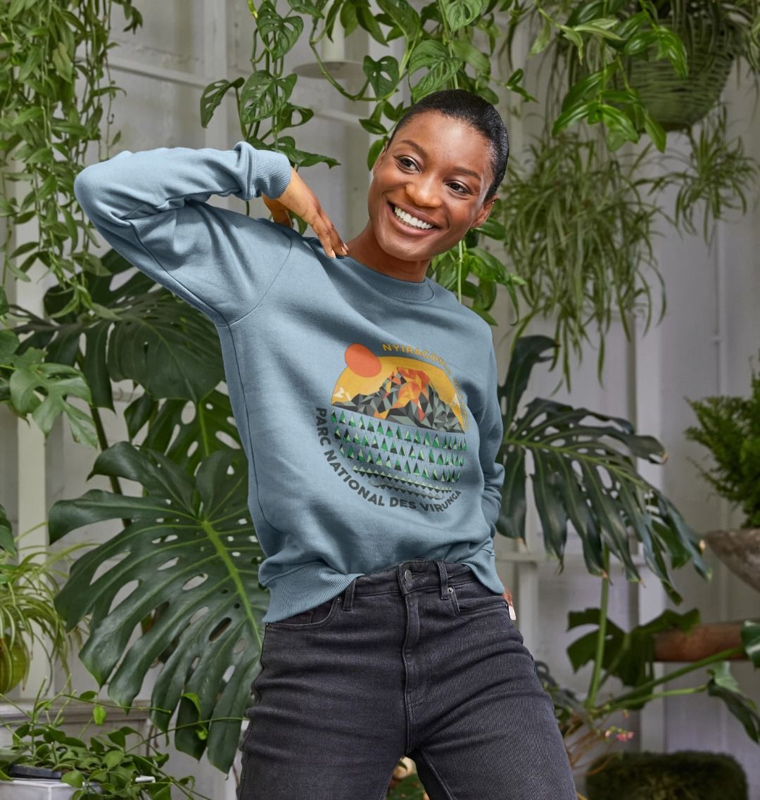 A woman wearing a stone blue Nyiragongo Volcano Women's Sweater
