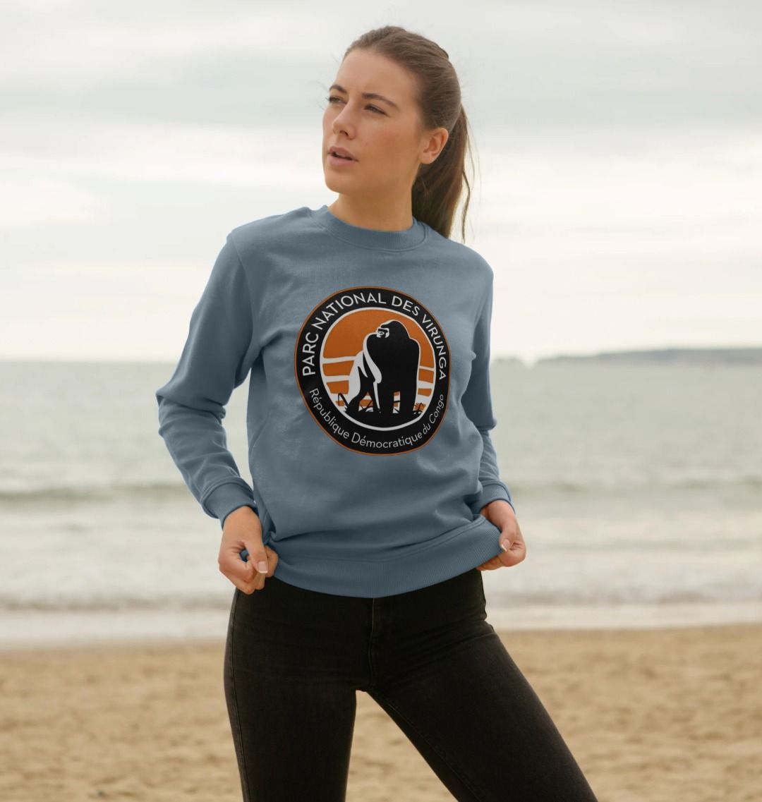 A woman wearing a stone blue Virunga Logo Women's Sweater