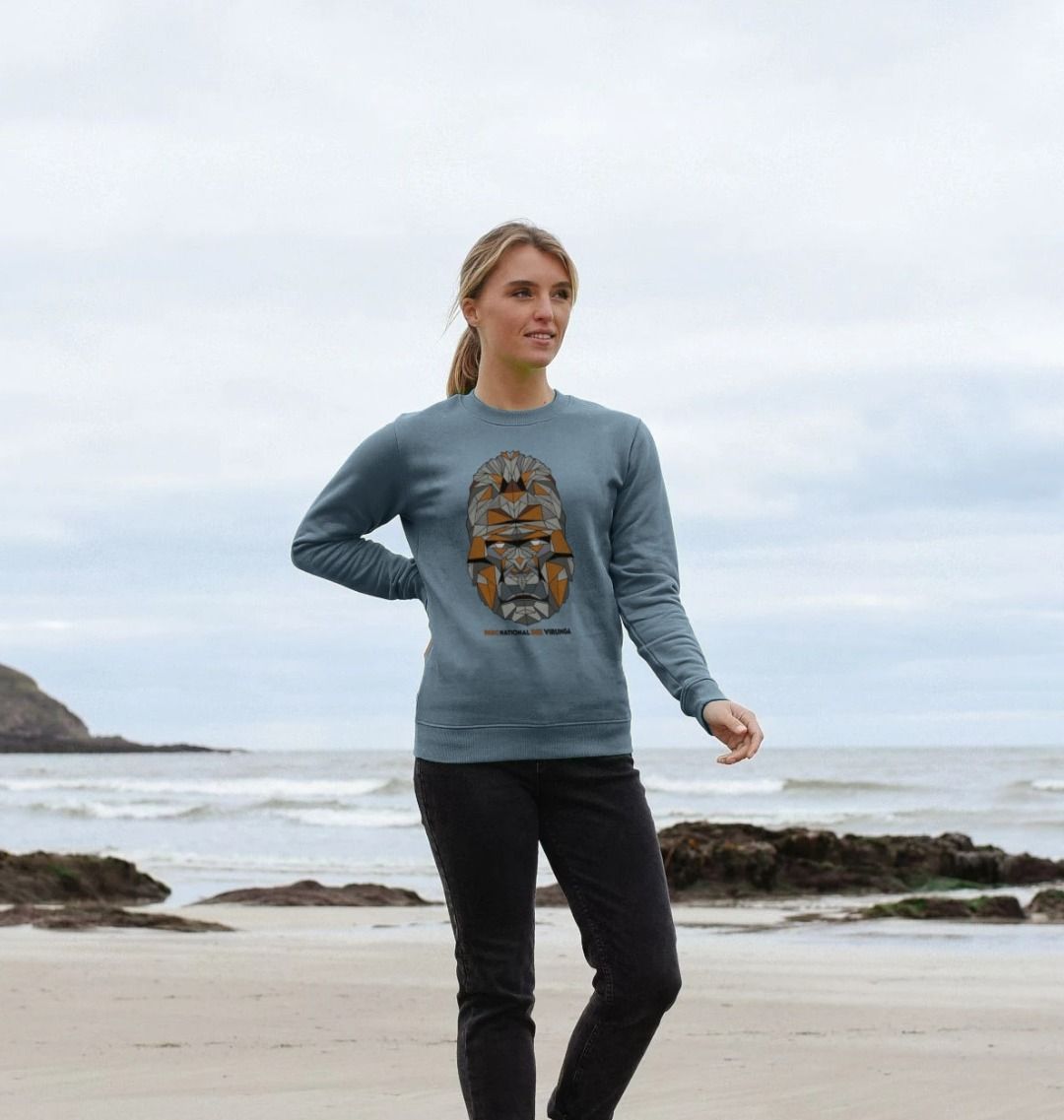 A woman wearing a stone blue Women's Gorilla Face Sweater 