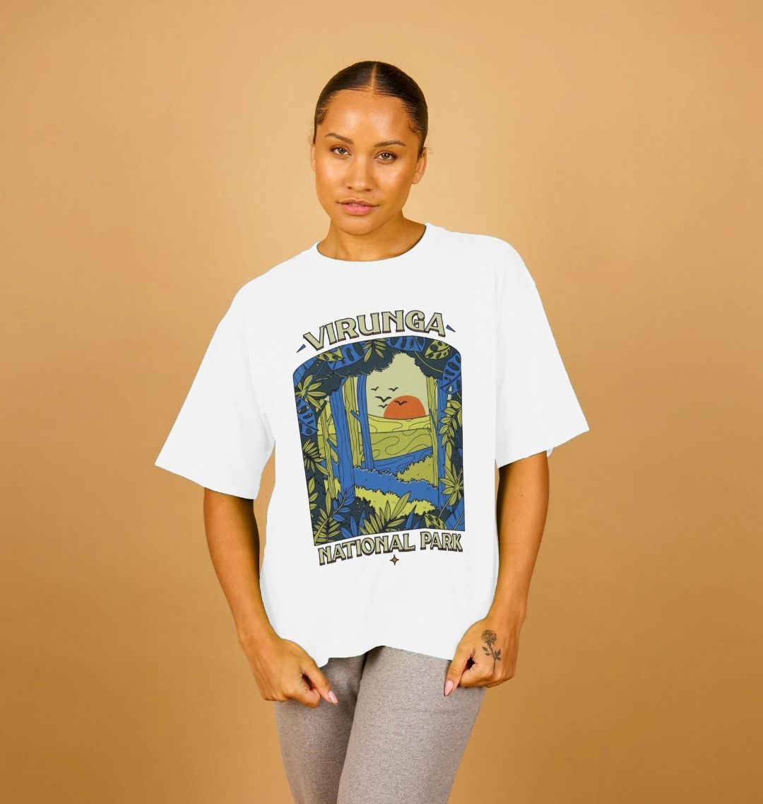 A woman wearing aa white Biodiversity Women's Oversized T-shirt