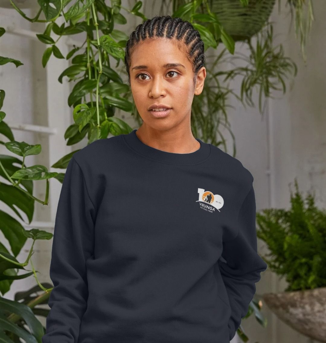 A woman wearing a blue Virunga 100 Women's Sweater