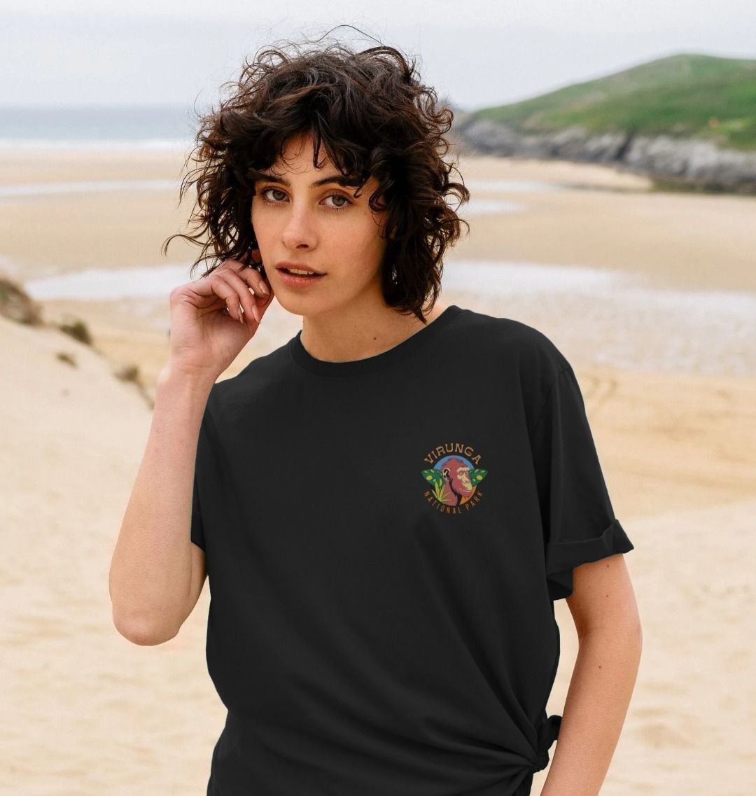 A woman with curly hair is wearing a black Endangered Chimp Women's T-shirt