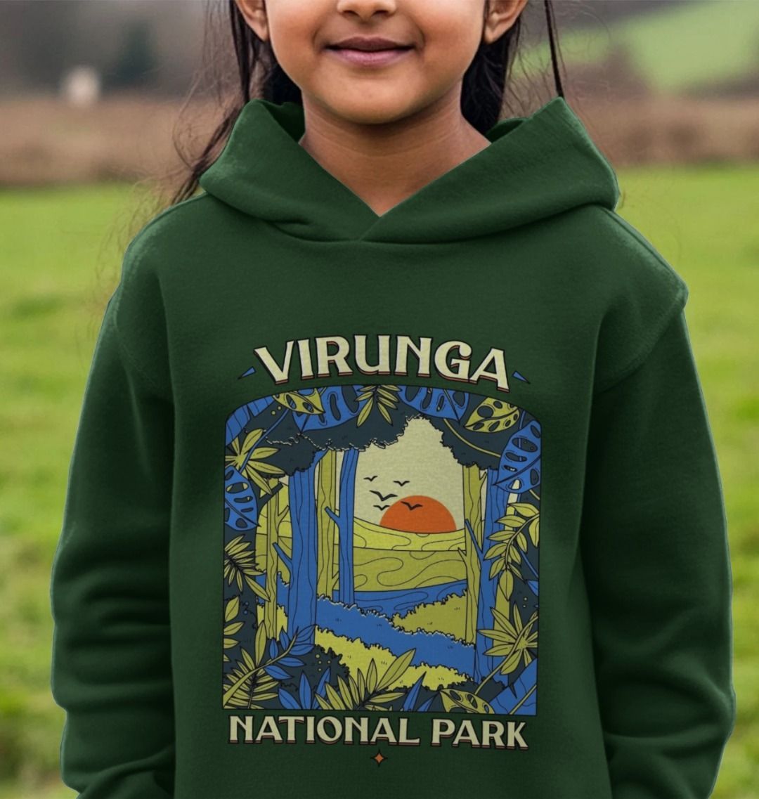 A child wearing a Evergreen Biodiversity Kids Hoodie.
