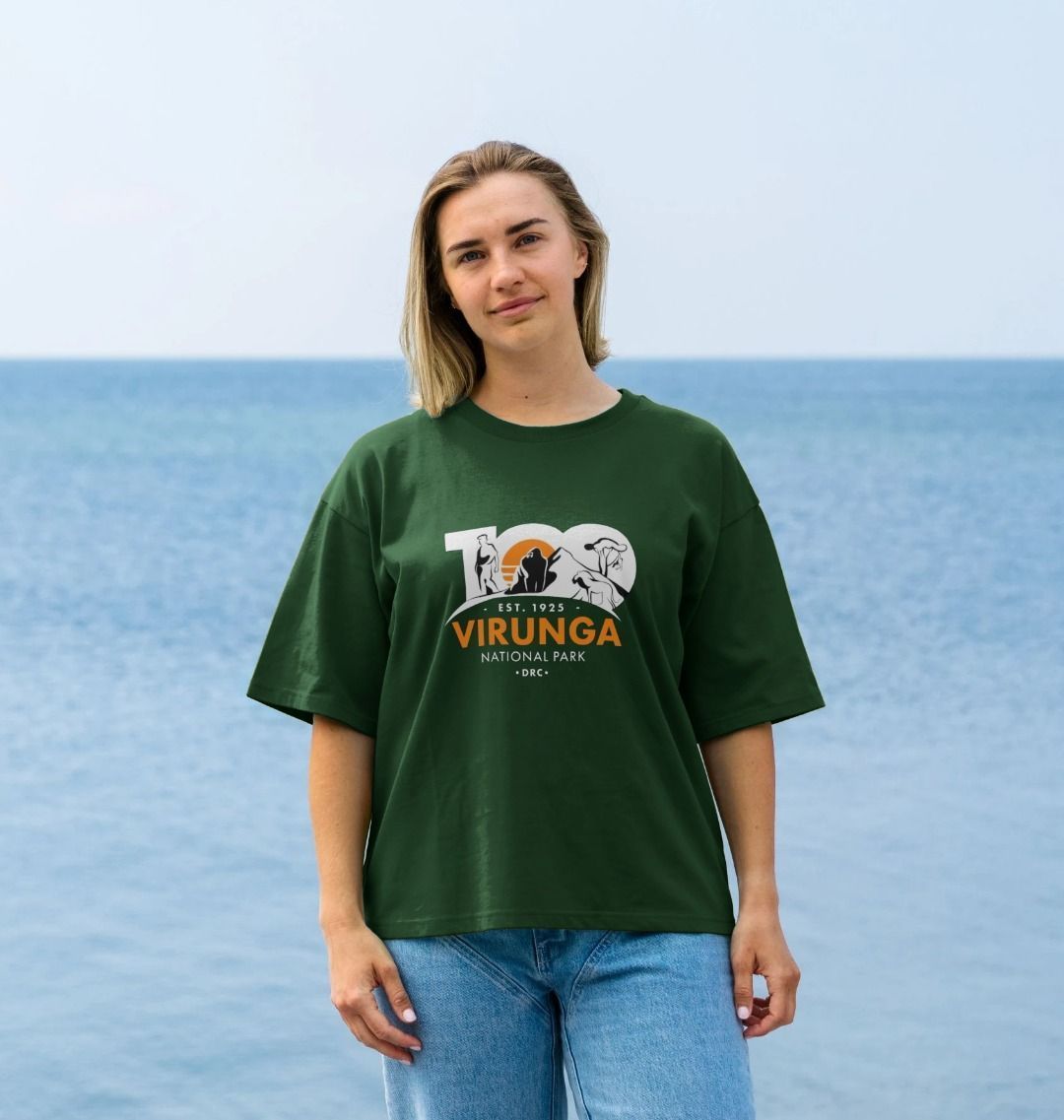 A woman wearing an evergreen Virunga 100 Women's Oversize T-shirt