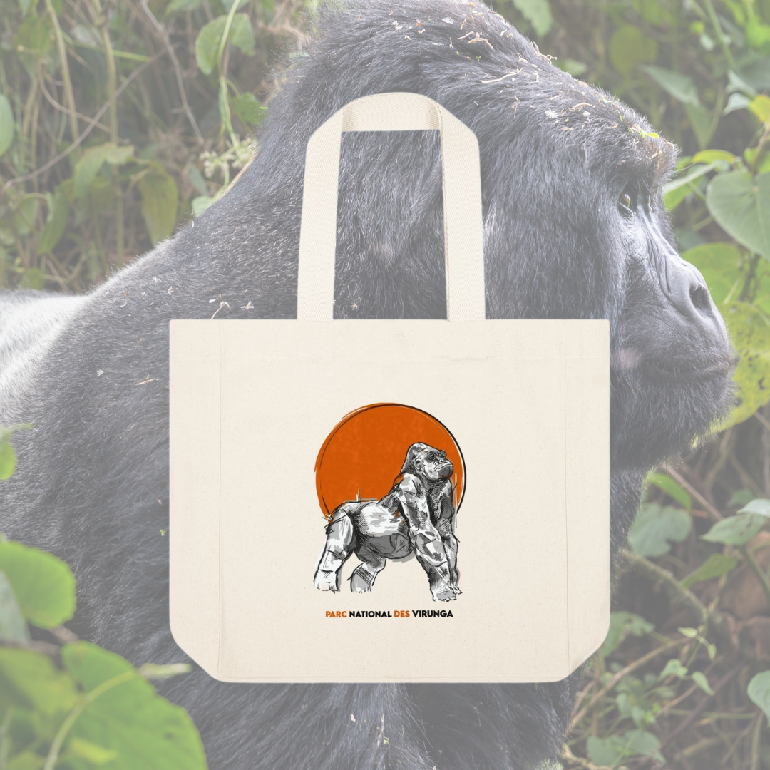 Tote bag with a gorilla design held by a gorilla in a natural setting