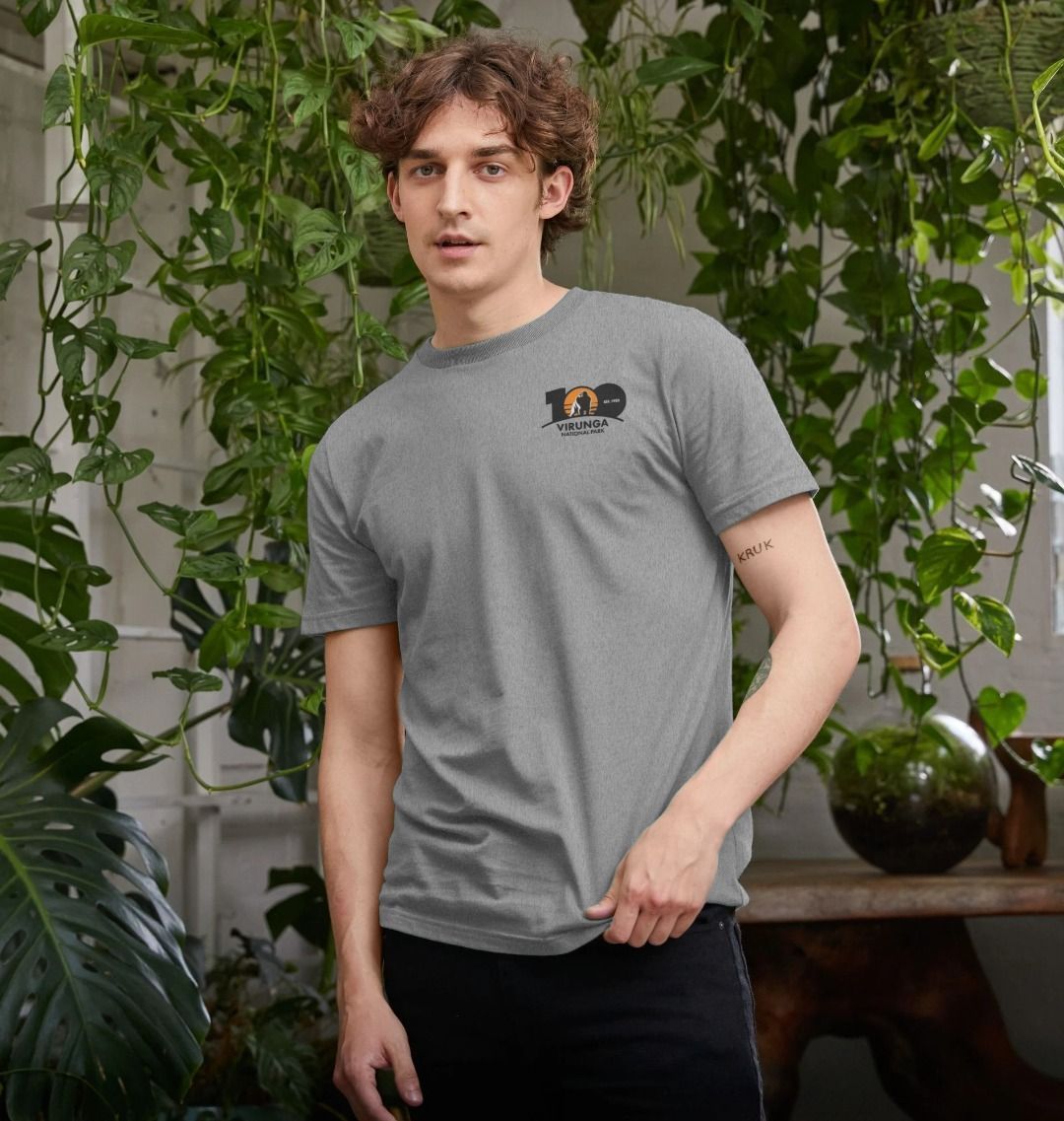 A man wearing an athletic grey Virunga 100 Men's T-shirt