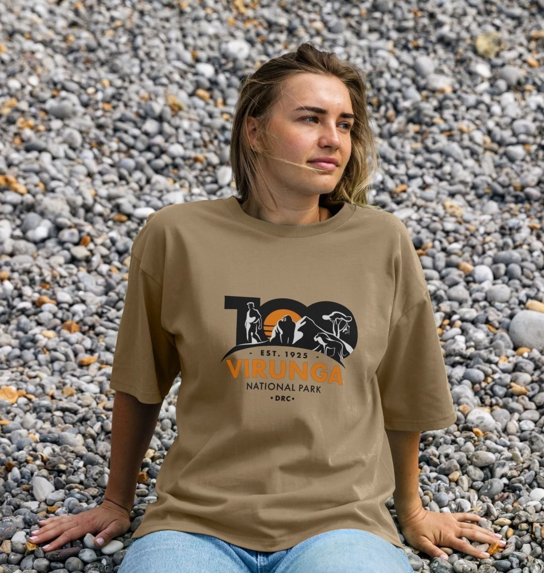 A woman wearing a chocolate Virunga 100  Women's Oversized T-shirt