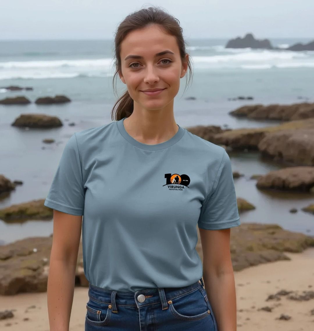 A woman wearing a stone blue Virunga 100 Women's T-shirt