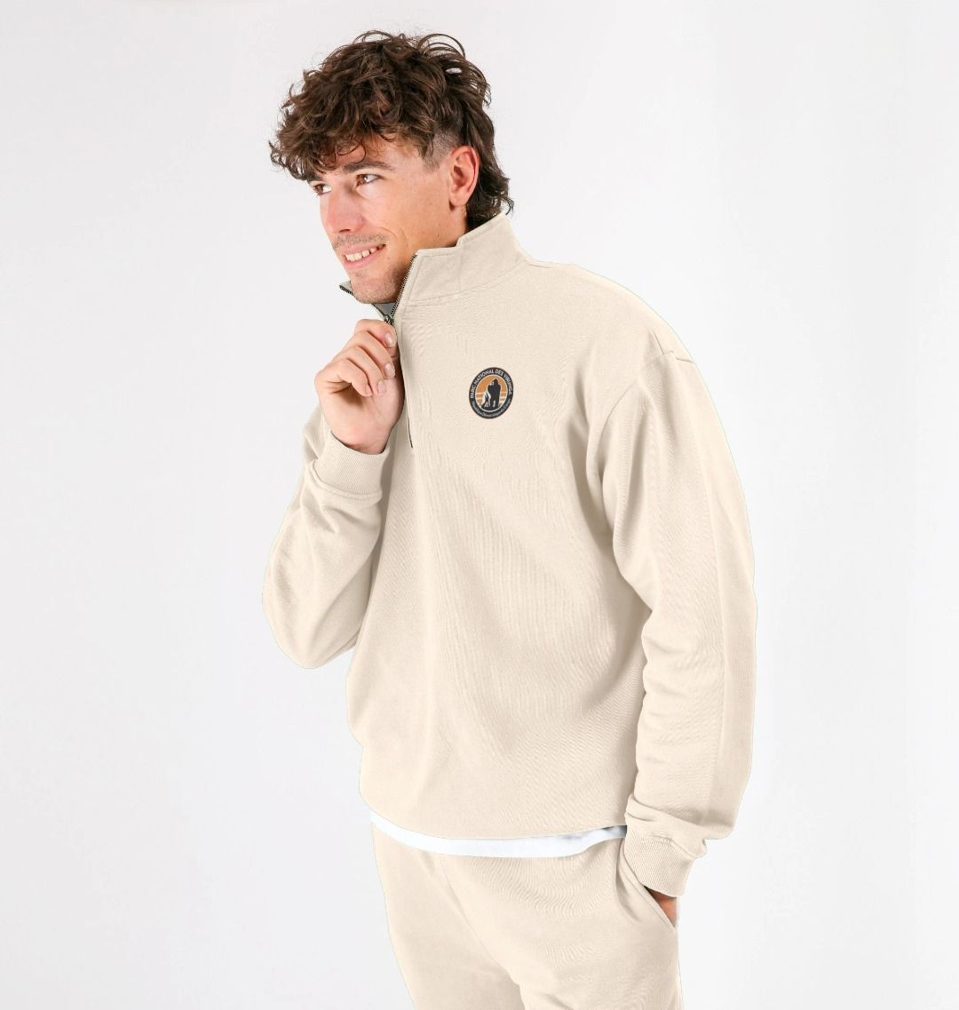 A person wearing an oat Virunga Logo Unisex Sweatshirt, standing against a white background.
