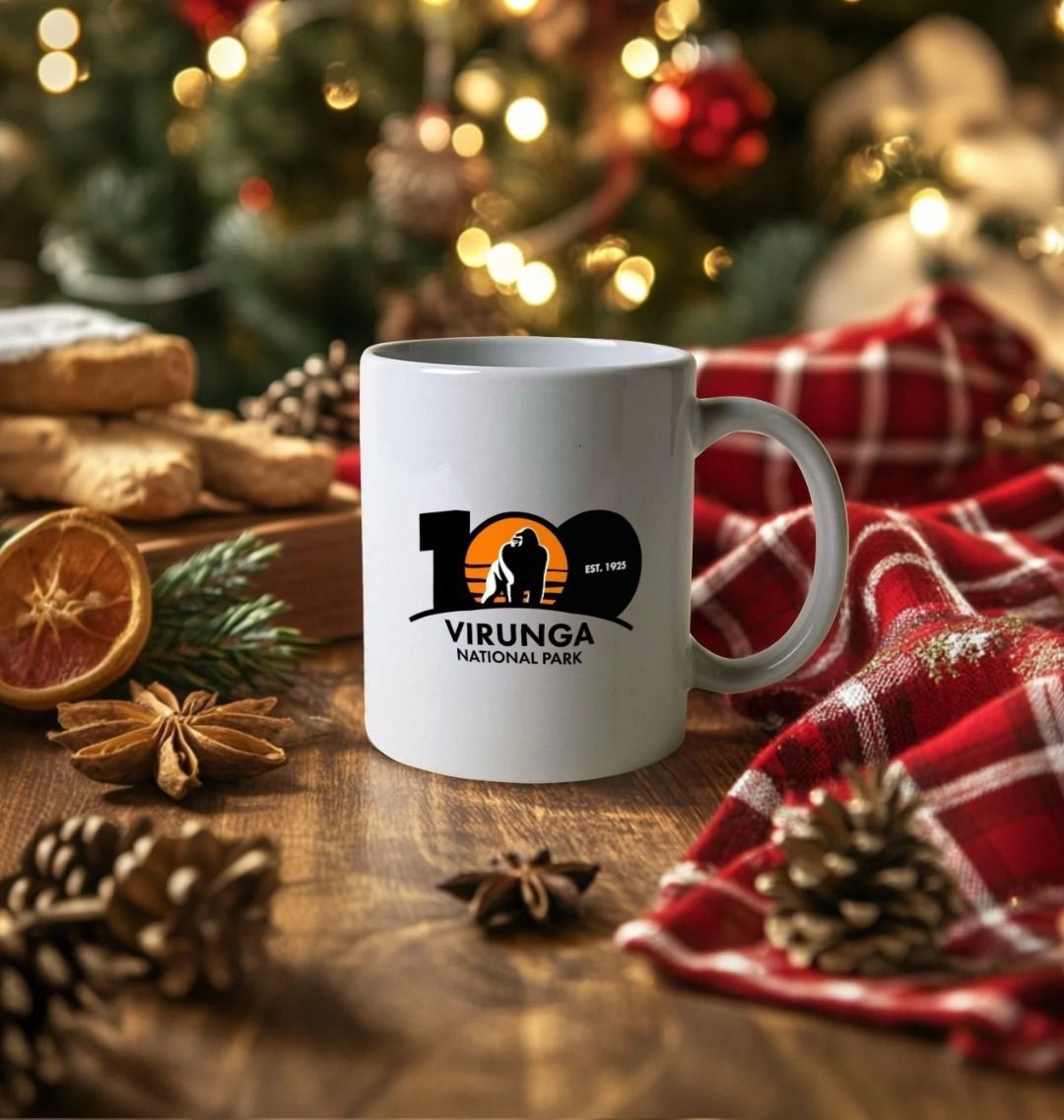 White mug with Virunga National Park logo on a festive table with Christmas decorations