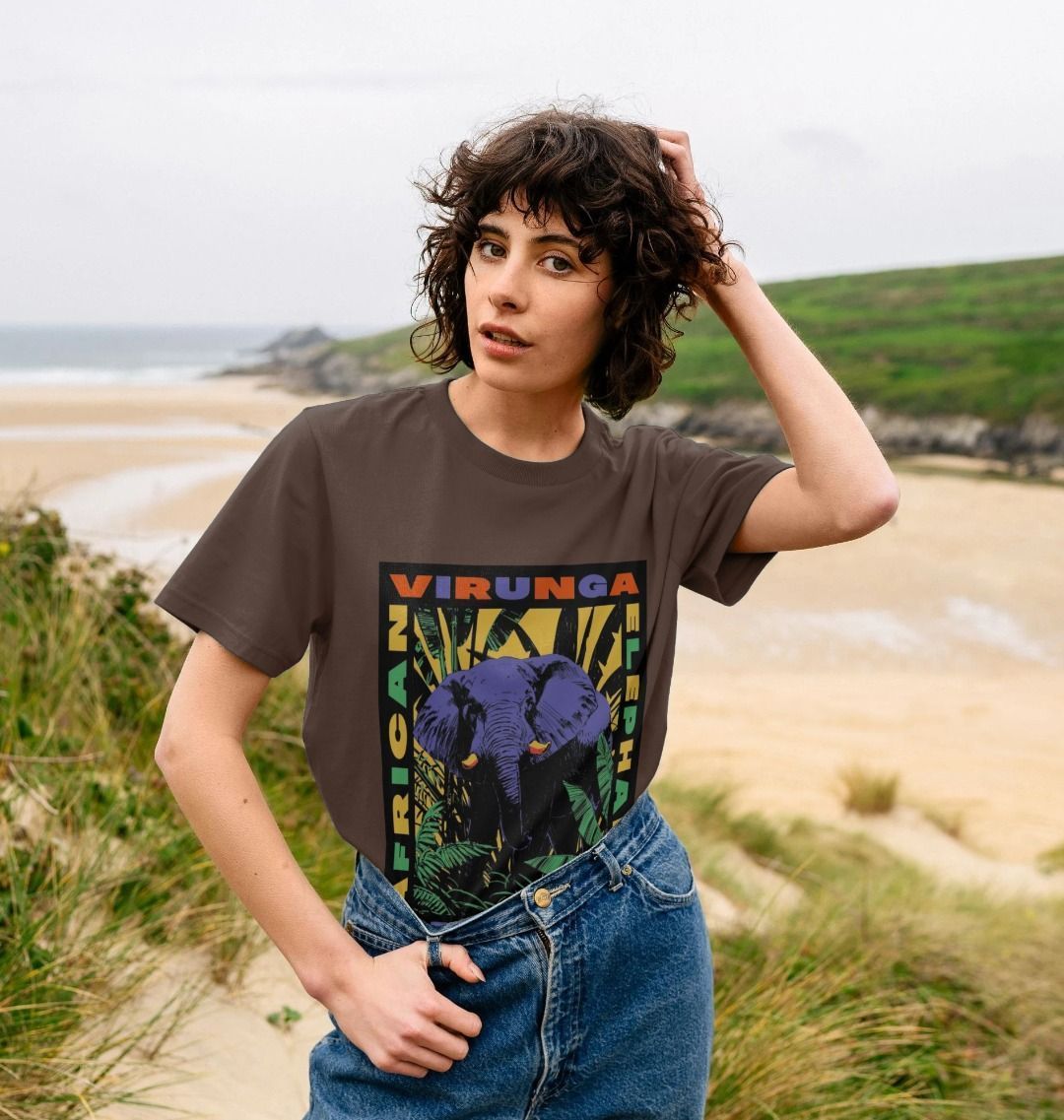 Woman Wearing a Chocolate Retro Elephant Women's T-shirt in a field