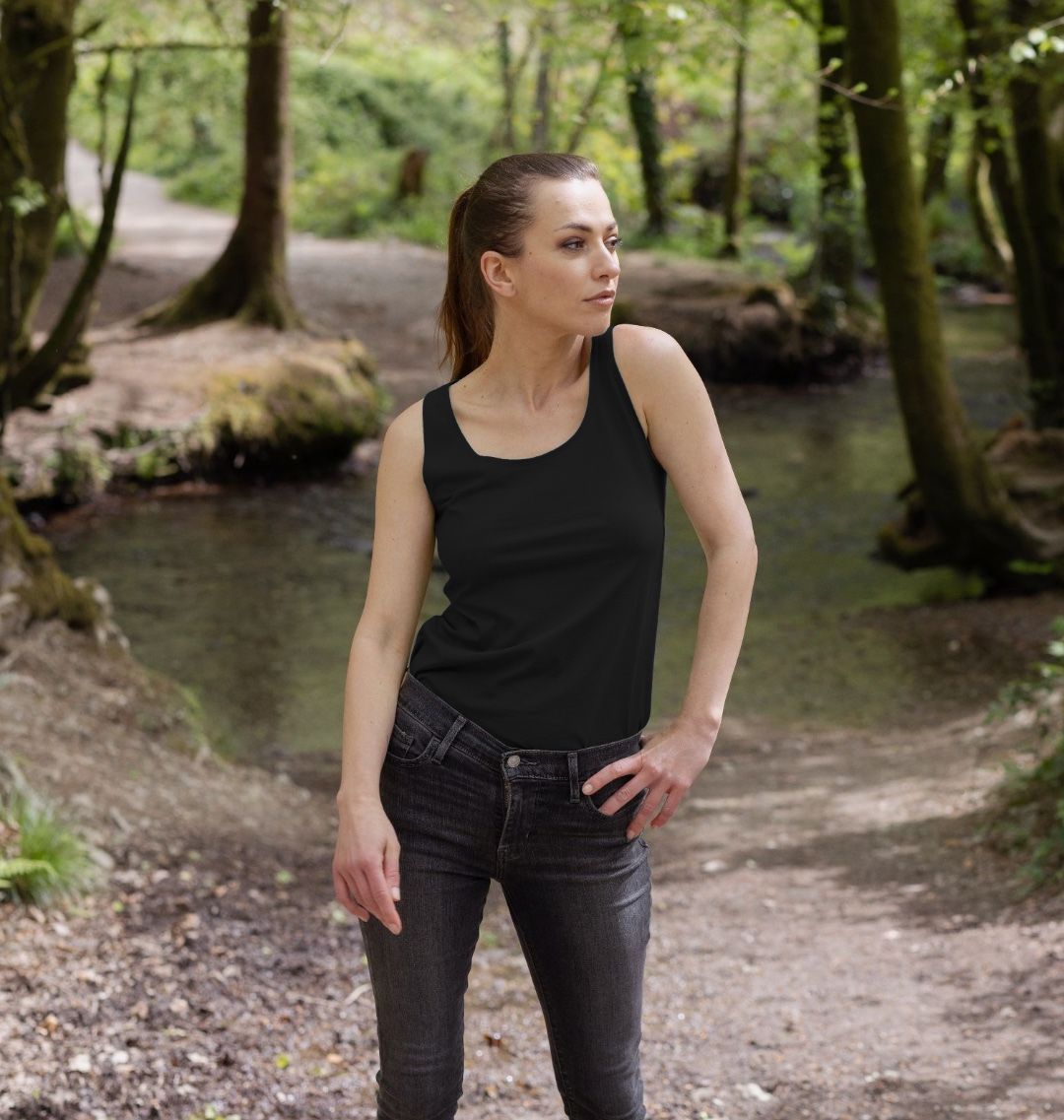 Woman in  a Black Virunga Pocket Logo Women's Vest (front)  in a forest  